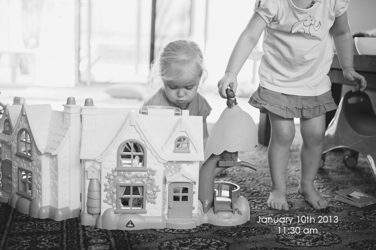 Playing with a dolls house brisbane baby photographer