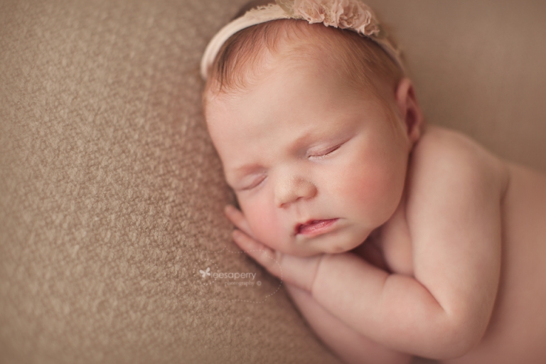 newborn baby girl in pinks and neutral colours